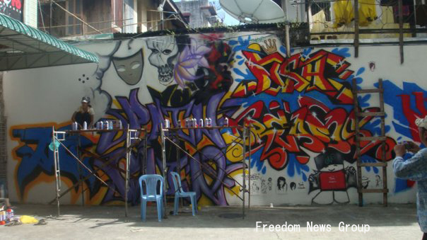 ရန္ကုန္တြင္ ပထမဦးဆံုးအႀကိမ္က်င္းပသည့္ နံရံေဆးမႈတ္ ပန္းခ်ီျပပြဲမွ ဂရစ္ဖစ္တီလက္ရာတစ္ခု