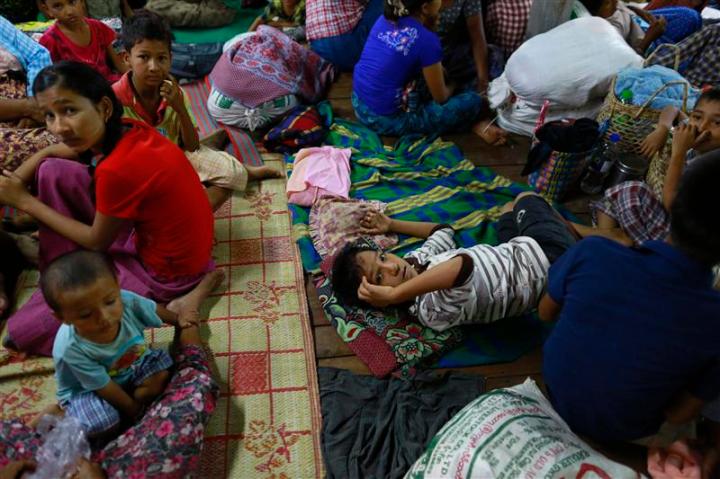 Muslims rest in a temporary refugee camp at Htan Kone village, in Myanmar's northern Sagaing region