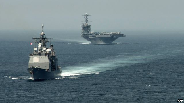 A picture released by the U.S. Navy shows the guided-missile cruiser "USS Gettysburg" (left) and the aircraft carrier "USS Harry S. Truman" transiting the Strait of Gibraltar earlier this month on their way to the Mediterranean Sea.